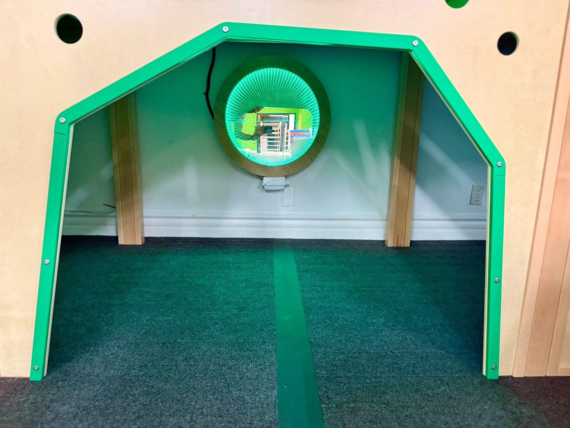 Green sensory nook with infinity mirror at Little Land Arcadia
