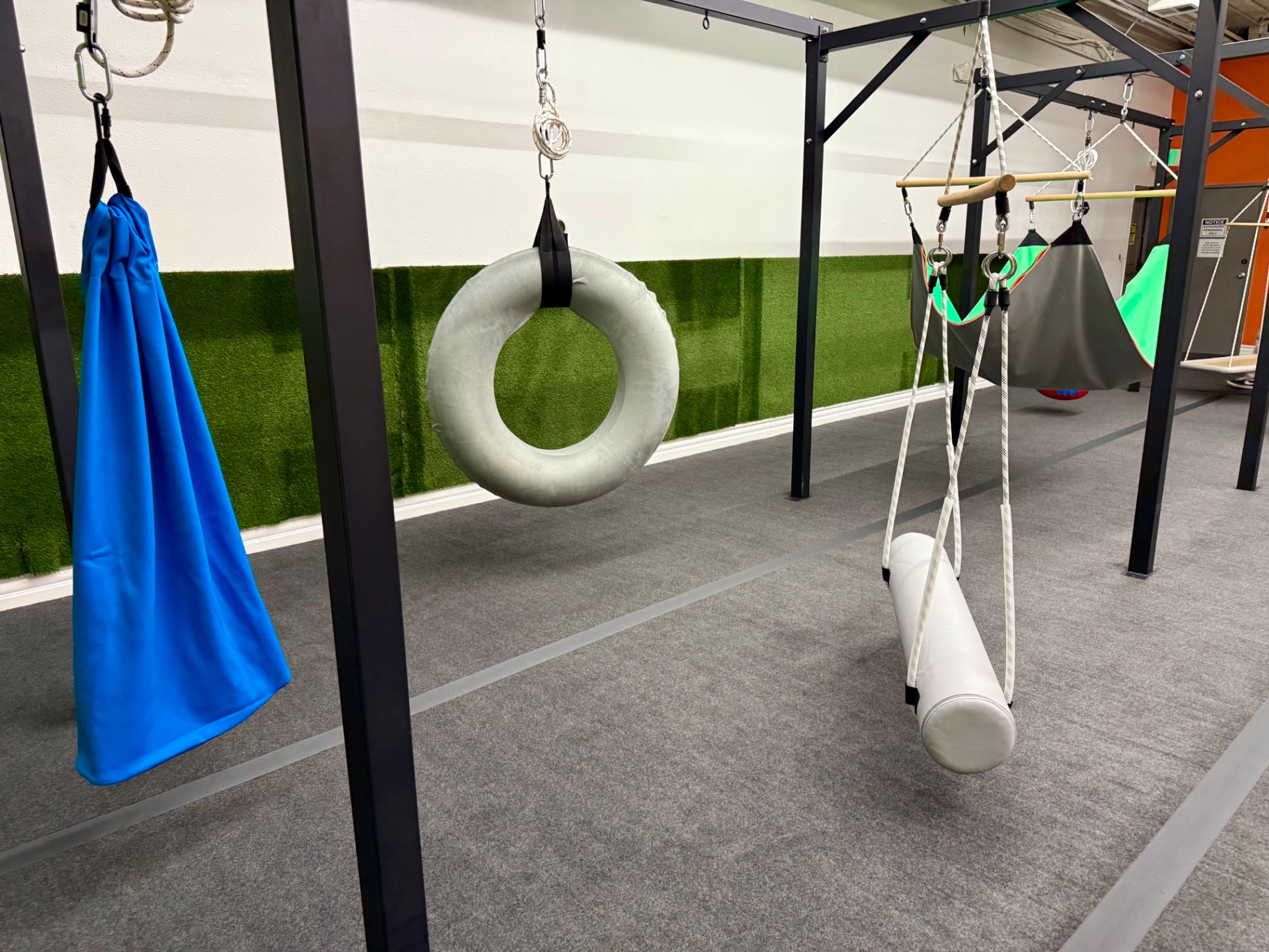 Tire swing, lycra swing, and platform swings on the suspension frame at Arcadia