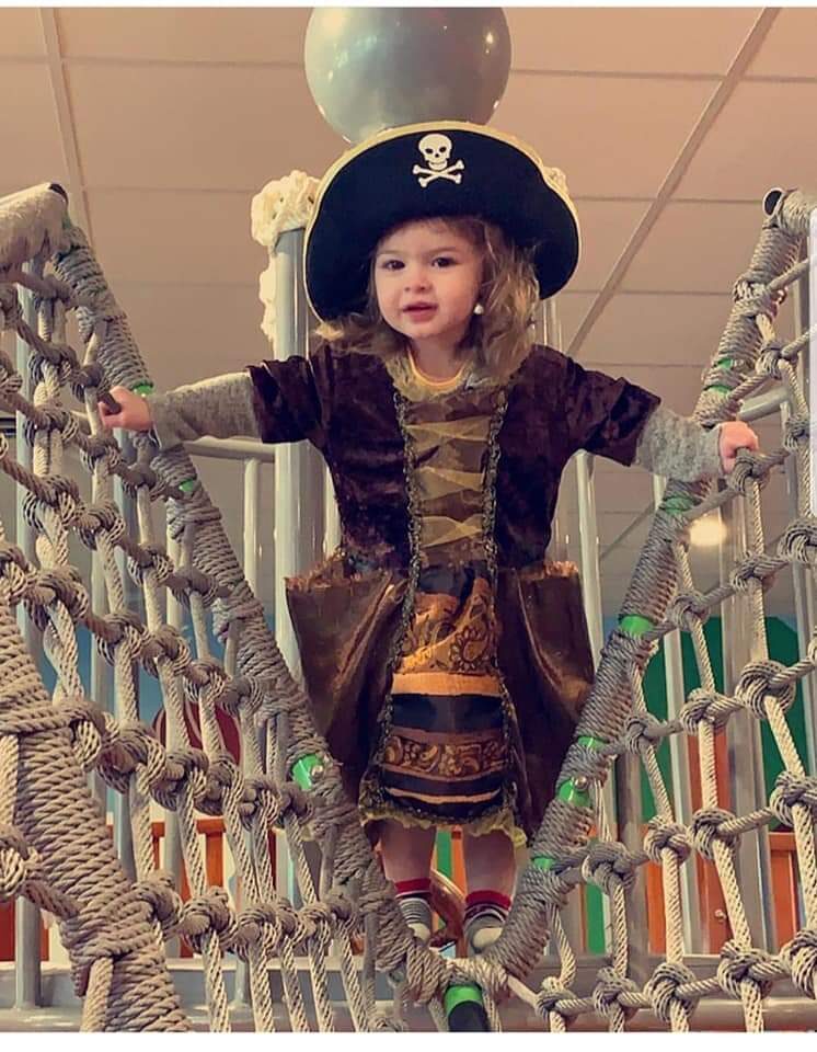 Two kids posing with the 'I ❤ LL @littlelandwaco' wall mural